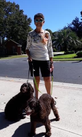OrthoSC patient, Monique, walking Maggie Mae and Dixie after her surgery