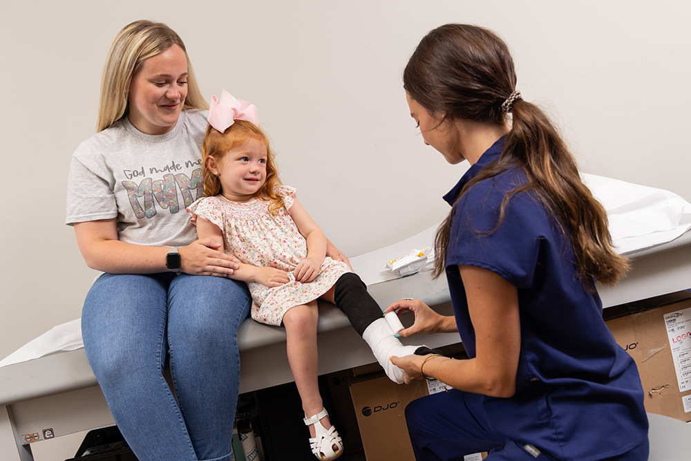 girl getting cast on leg