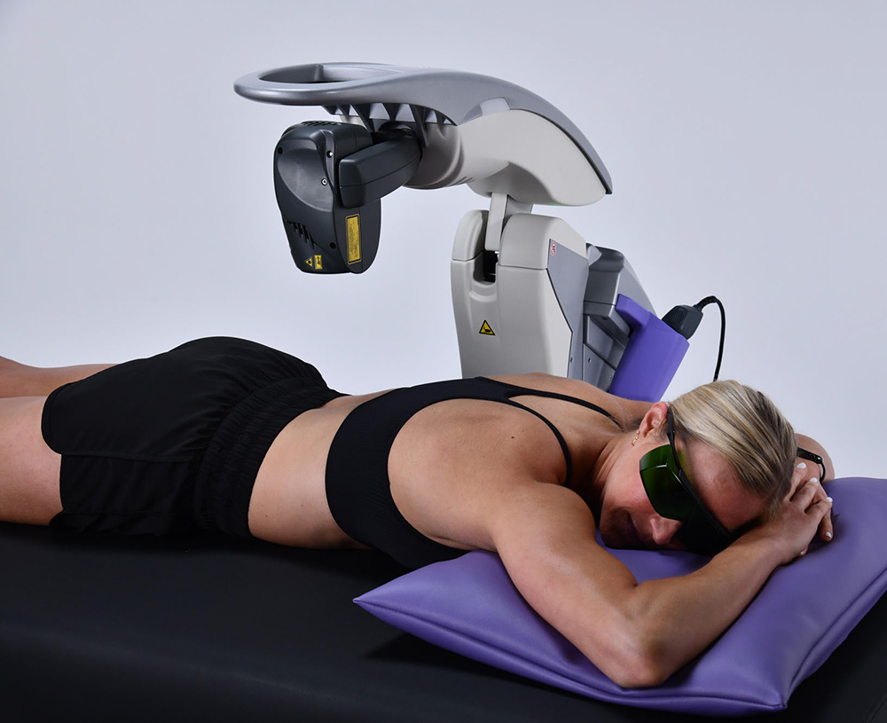 woman laying on table receiving mls therapy