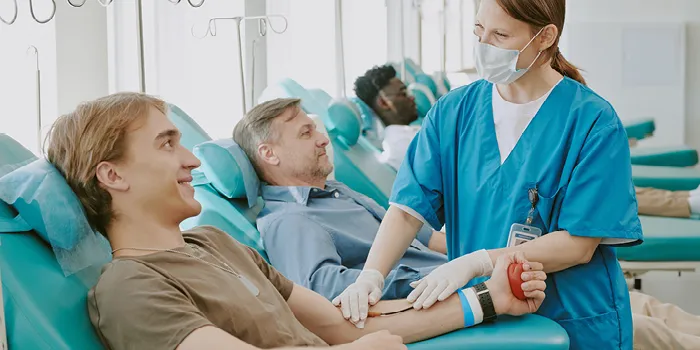 Guy getting his blood drawn