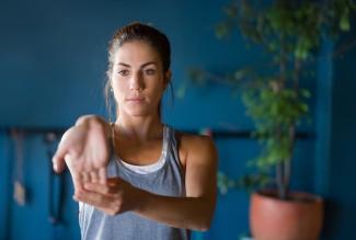 Woman stretching her forearm